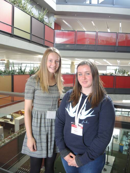 LEARNING: Aleisha Hansford and Ruby Baker have completed work experience at the Bendigo Bank. Picture: HANNAH CARRODUS