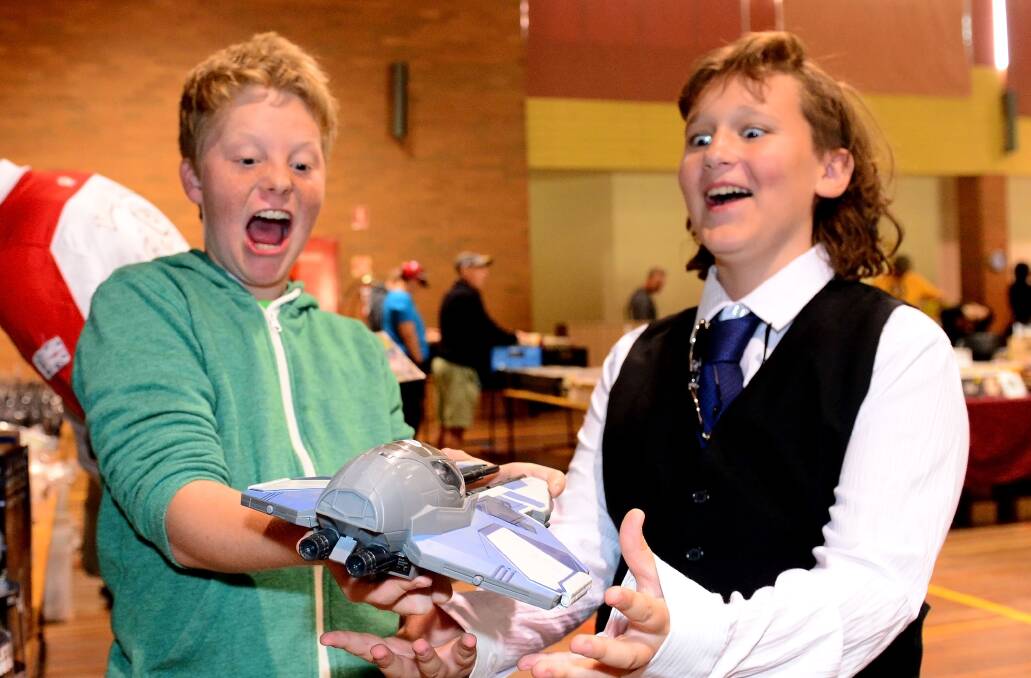 AMAZED: Josh Gattshce and Tyler Riddell are thoroughly excited by the toys on show. Picture: LIZ FLEMING

