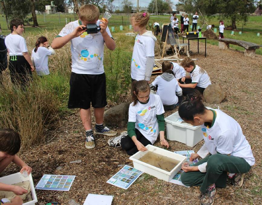 LEARNING: Students teaching one another about green initiatives at Redesdale Mia Mia Primary. Picture: CONTRIBUTED