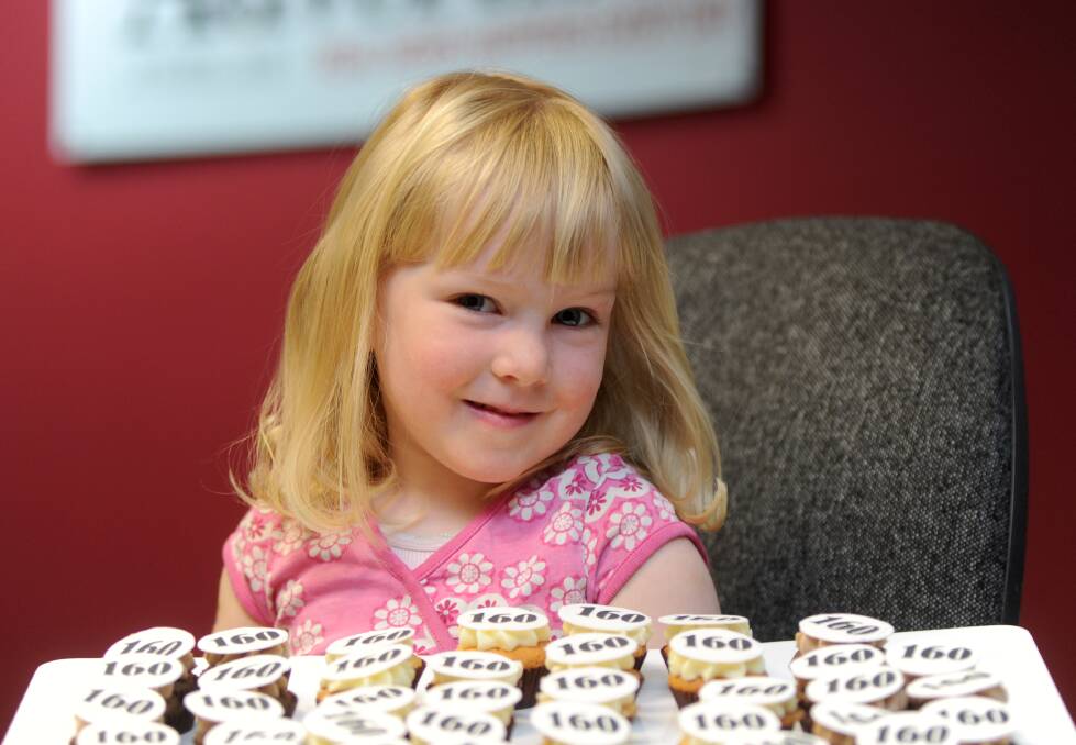 DELICIOUS: Audrey Savage, 2, enjoyed a 160th cupcake on Monday. Picture: JODIE DONNELLAN