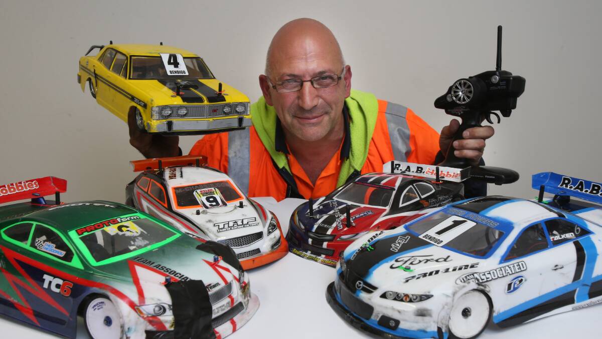 FLEET: Theo Theodorou with a few of his cars. Picture: PETER WEAVING