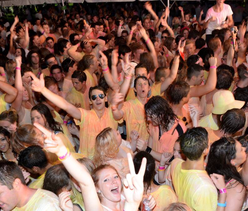 FUN: Students dance at the glow-paint party on Wednesday.