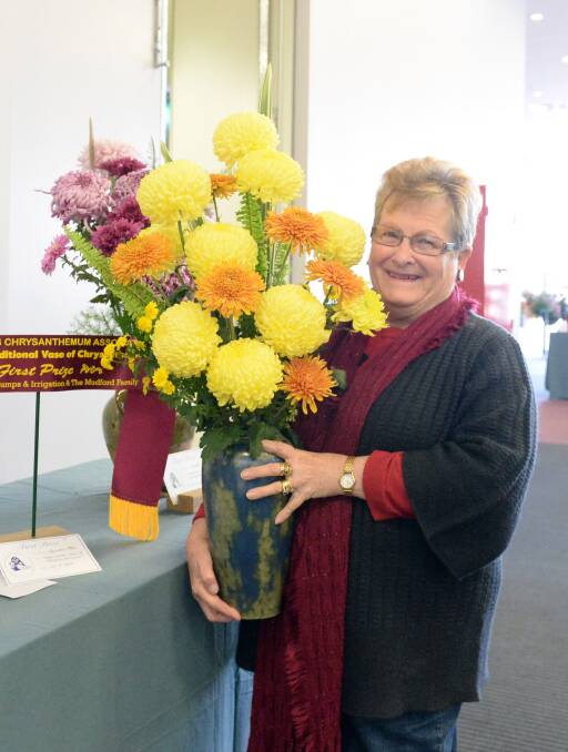COLOURFUL: Lynette Holt with one of her arrangements. Picture: LIZ FLEMING