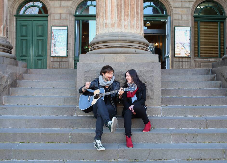 MUSIC: Tom Parsons and Madeleine Jones play songs on the steps of The Capital theatre.