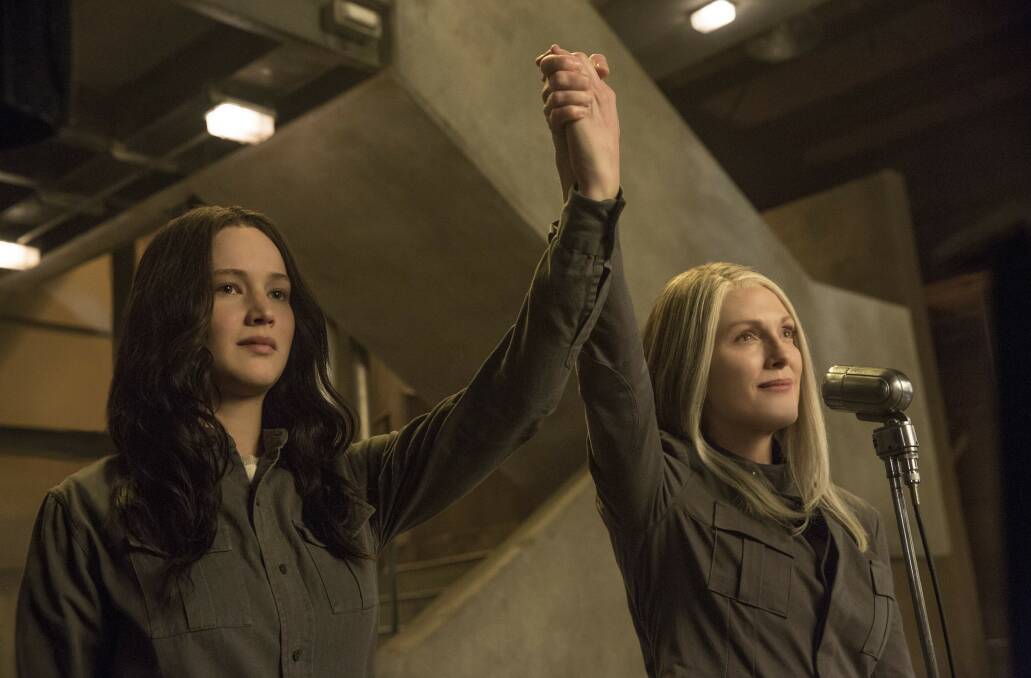 UNITED: Katniss (Jennifer Lawrence)  and President Coin (Julienne Moore)  take on the Capitol in Mockingjay Part 1.