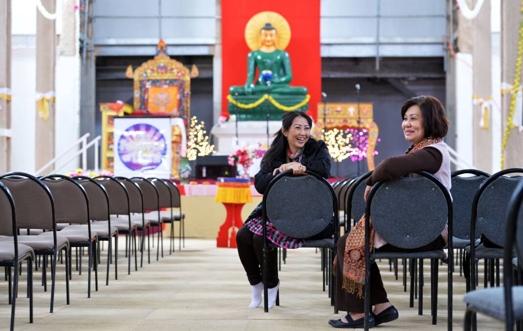 READY: Melbourne volunteers Anney Truong and Tiffany Ho during festival preparations. Picture: BRENDAN McCARTHY