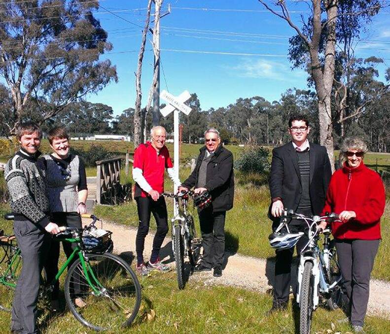 PEDAL POWER: City of Greater Bendigo's Robert Kretschmer,  Axedale: Our Town Our Future's Yvonne Wrigglesworth, Friends of Bendigo-Kilmore Rail Trail's Lawrie Edward, Junortoun Community Action Group's Ian Ross, City of Greater Bendigo's Steven Abbott and Junortoun Community Action Group's Denise Johns prepare for the ride. Picture: CONTRIBUTED