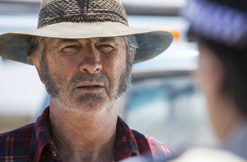 FAR LEFT: The covers of Greg McLean’s new Wolf Creek books.
LEFT: McLean and John Jarratt (in costume as Mick Taylor) have a chat between takes.
ABOVE: Actors Phillipe Klaus and Shannon Ashlyn get some direction on the set of Wolf Creek 2.
BELOW: Mick Taylor (John Jarratt) returns in Wolf Creek 2 on February 20.