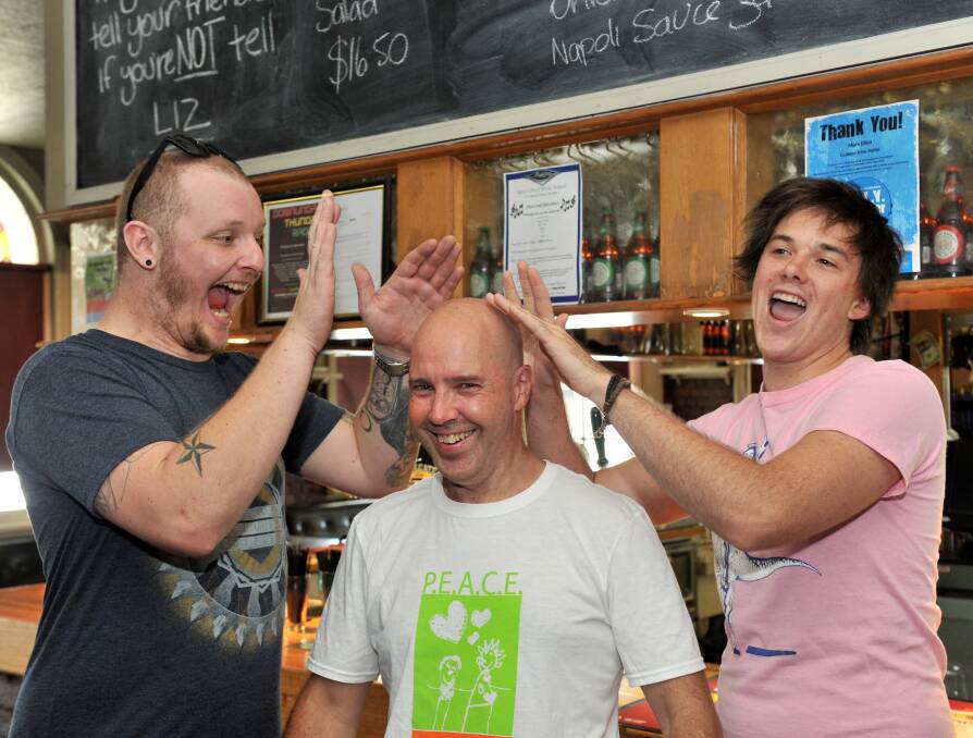 LAUGHS: Comedians Jimi Norrstrom and Paddy Walters with P.E.A.C.E president Phil West. Picture: JODIE DONNELLAN
