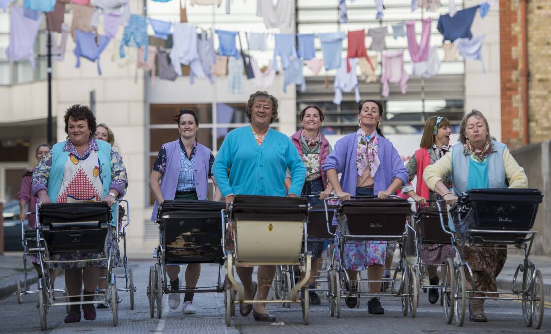 FUN: Mrs Brown leads her fellow market workers during "D'Movie".