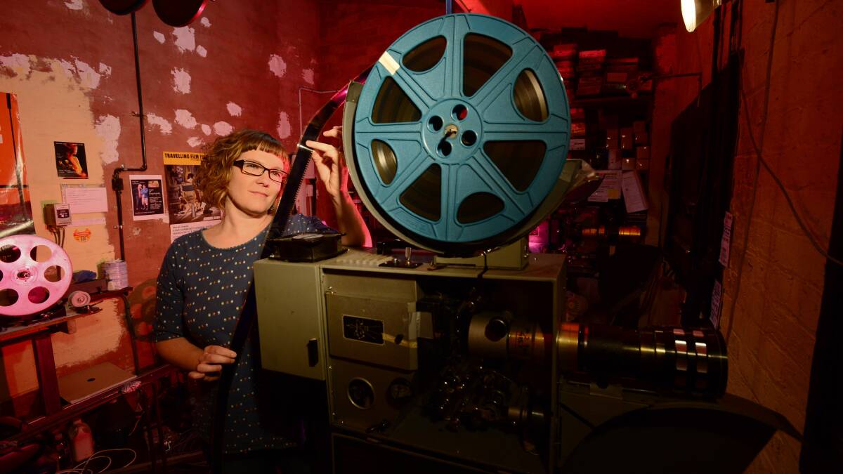 UPGRADE NEEDED: Hannah Morton in the projector room.