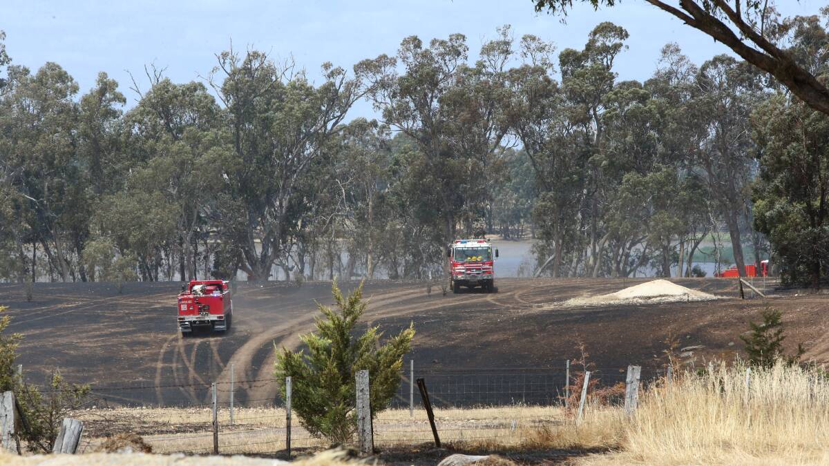 MOPPING-UP: At Laanecoorie in a grass fire. Picture:  PETER WEAVING