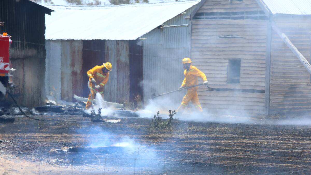 MOPPING-UP: At Laanecoorie in a grass and structure fire. Picture:  PETER WEAVING