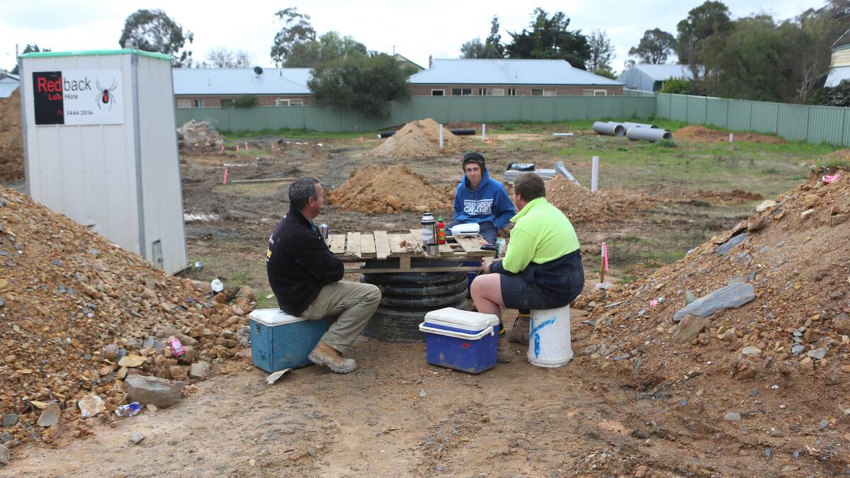 Plumbers lunch break at a building site in Marong Road in West Bendigo, are Duncan Murley, Jack Forder and Tom Elliott from Haughton Plumbing. 

Picture: Peter Weaving 
250713
