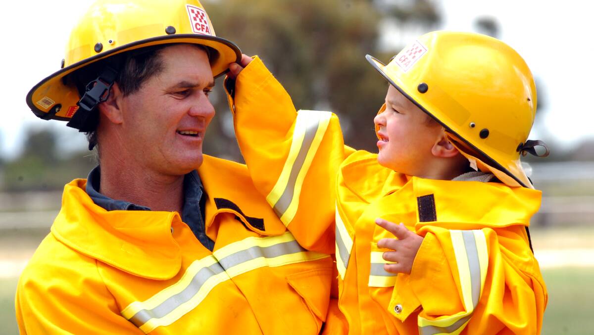 Bruce Moon with his 3 year old son Bradley at the Pyramid Hill Emergency Services Day. Picture ; PETER HYETT.