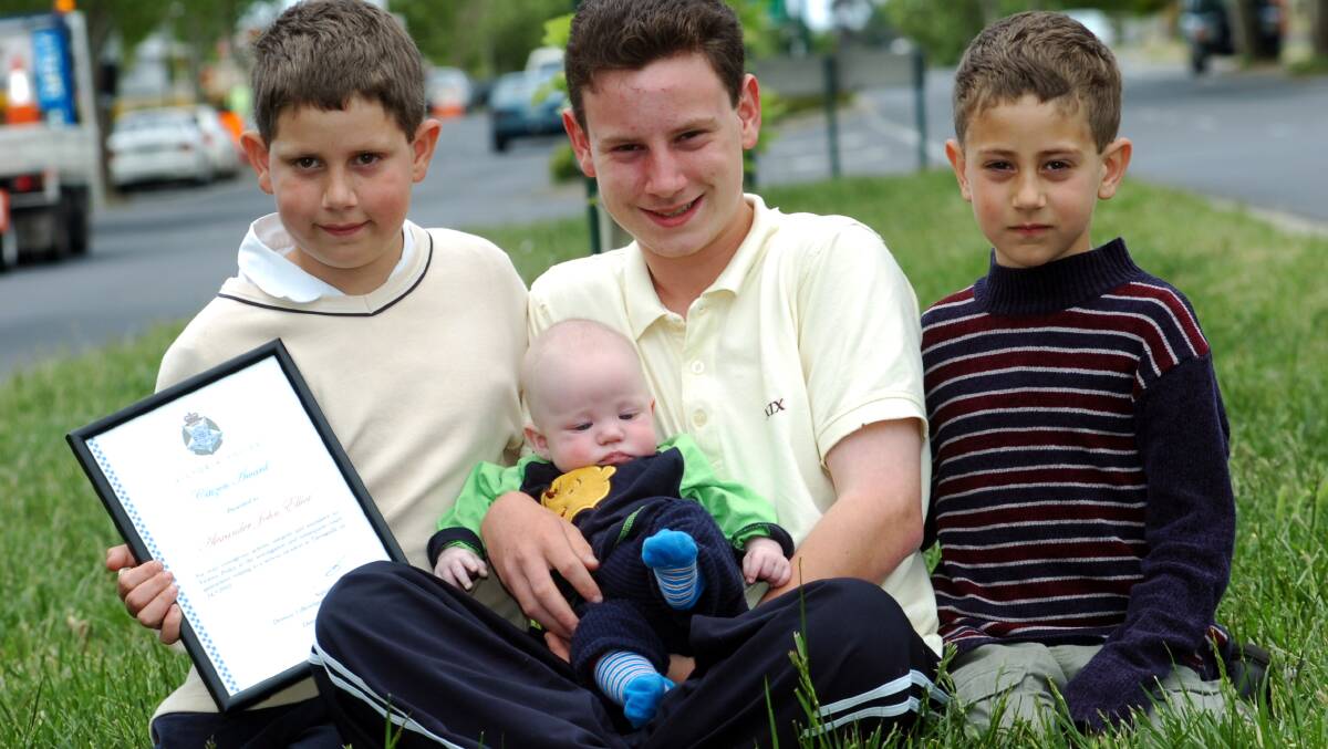 Alex Elliot with his brothers Cameron, Michael and baby Will. Picture ; PETER HYETT.