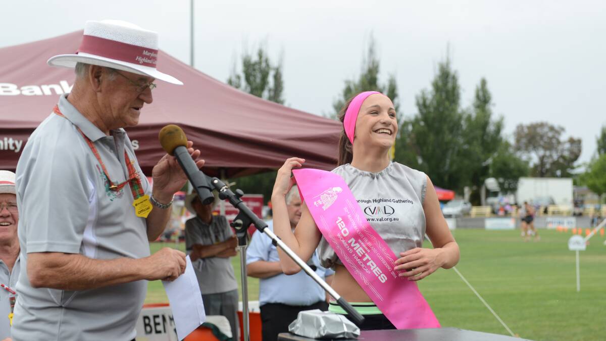 Brian Eyers presents Jessica Payne with her sash after she won the Women's 120m Necklace event.

Picture: JIM ALDERSEY