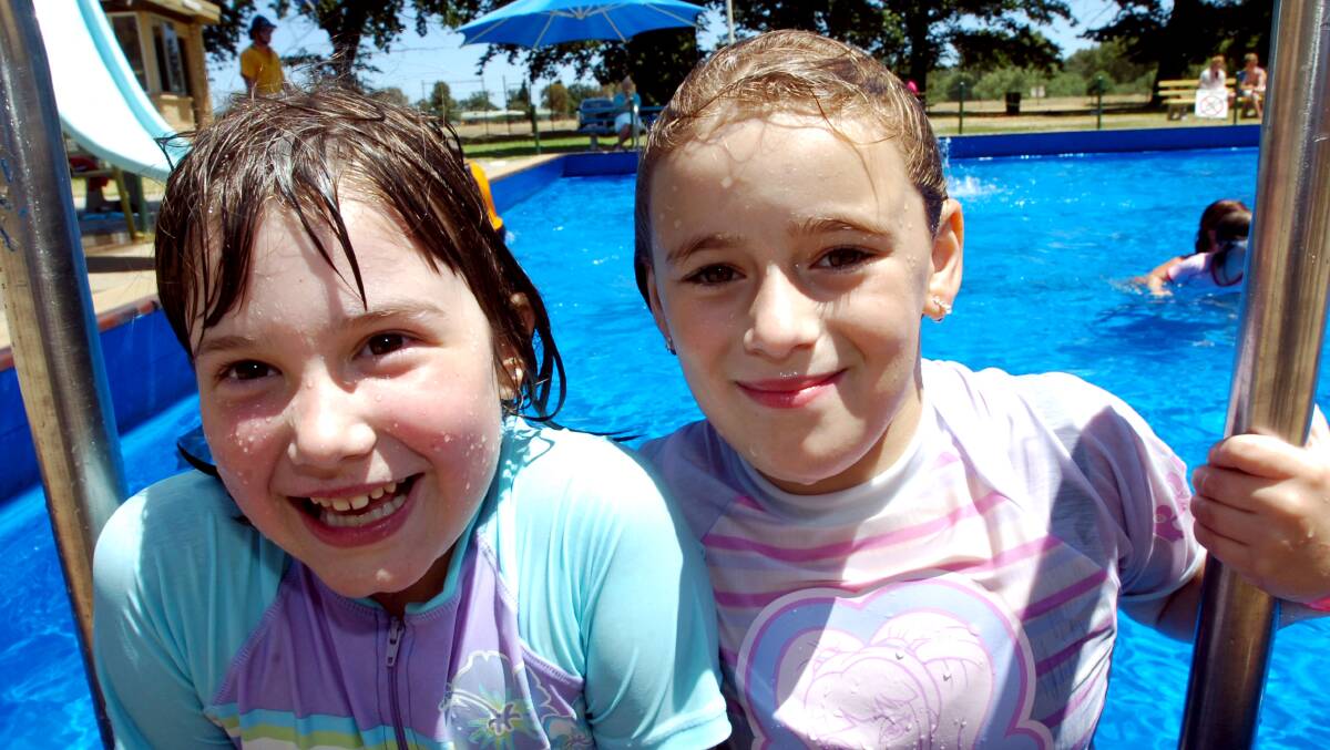 Amber McConnell and Tyler Albert at the White Hills pool during the YWCA holiday program. Picture ; PETER HYETT.