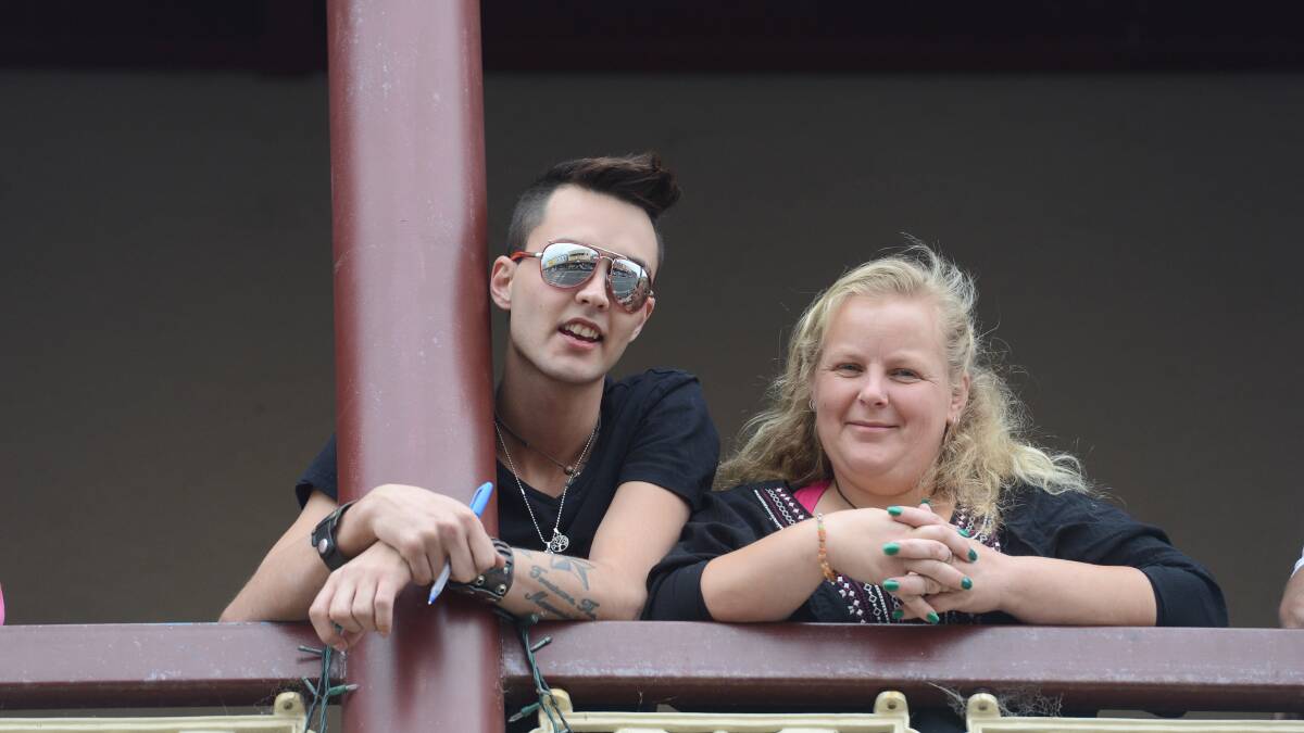Cody Robertson and Tammy Heywood get a better view of the parade from the Flag Hotel balcony.

Picture: JIM ALDERSEY