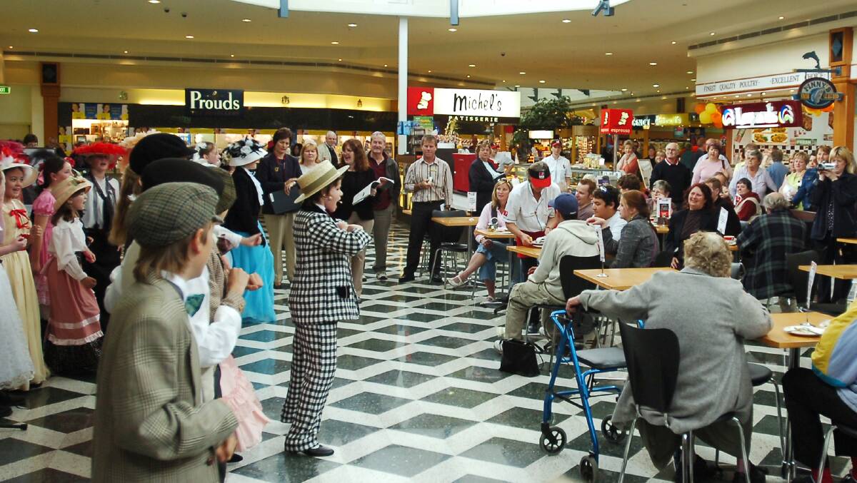 St Joseph's PS students perform songs from The Music Man at The Marketplace.
pic ; LAURA SCOTT. 27.10.05