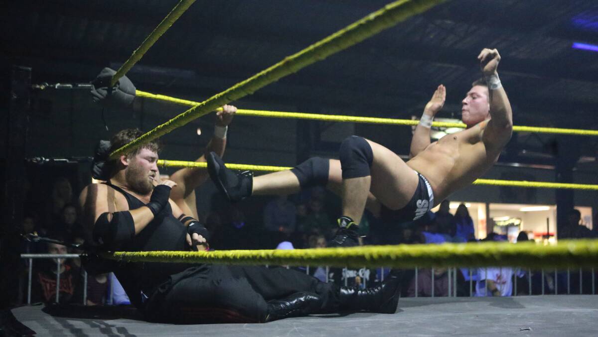 Wrestling show at The Zone, local boy Cadman takes a hit from Josh Extreme.
Pictures: Peter Weaving
