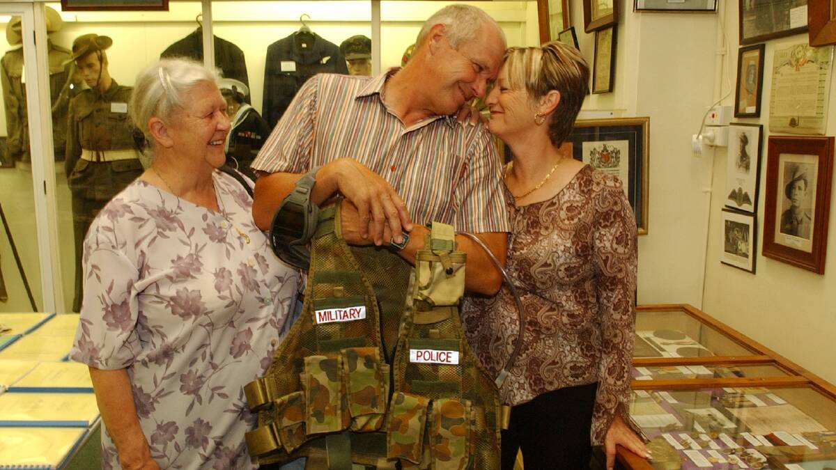 Greg Westhead with the Military Police uuniform he is donating to Bendigo RSL with his mum Edna Westhead at left and wife Joyce at right
Pic Brendan McCarthy 100106