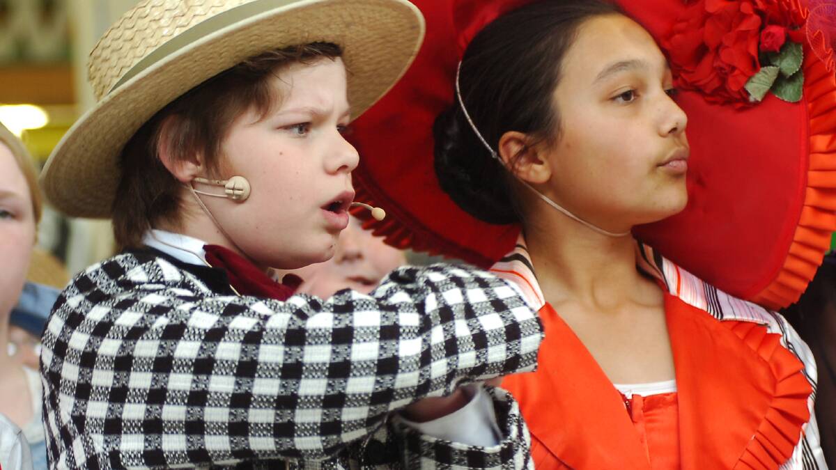 St Joseph's PS students perform songs from The Music Man at The Marketplace - Aaron Lynch & Anusha Jayasekera.
pic ; LAURA SCOTT. 27.10.05