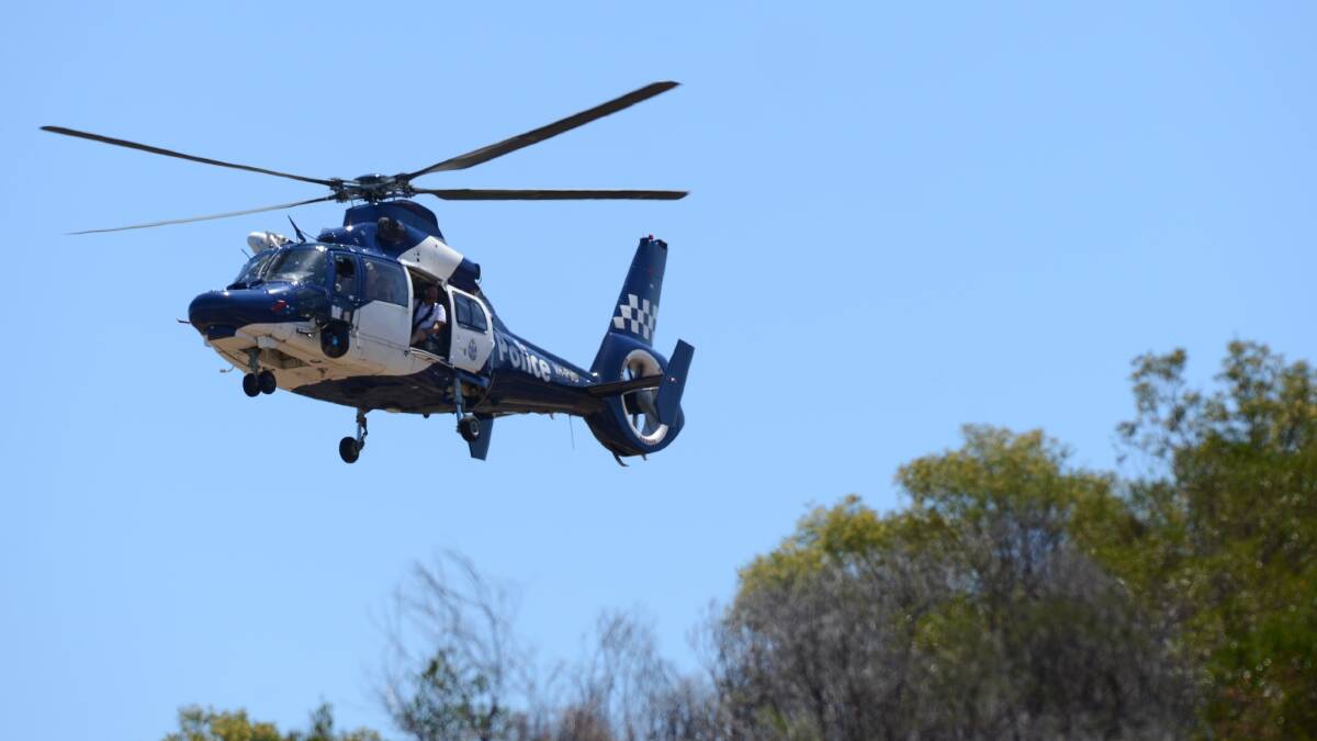 Police helicopter is flying over the mountain to help locate the body. Picture: Jim Aldersey