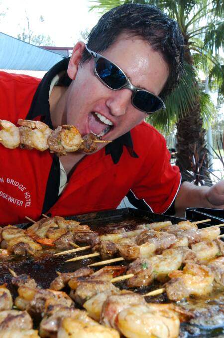 Matt Lawrence enjoys the bbq praws at the Bridgewater Hotel cup day celebrations. Picture ; PETER HYETT.