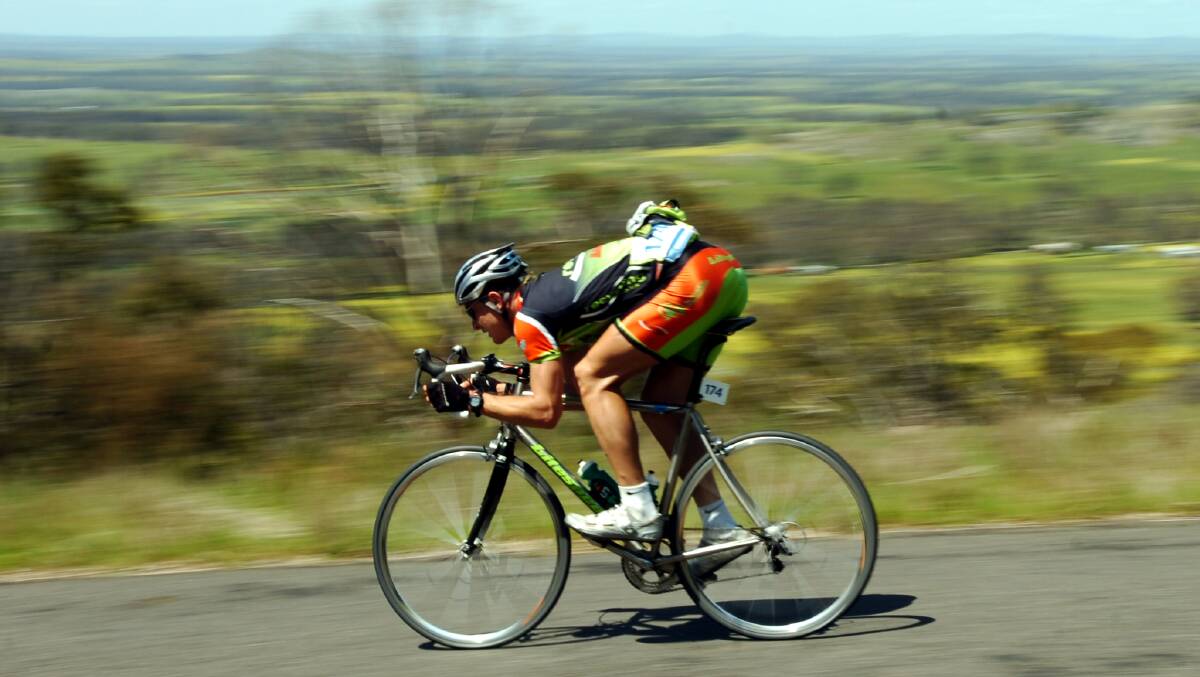 Tour riders speed down Mt Alexander. Picture ; PETER HYETT.