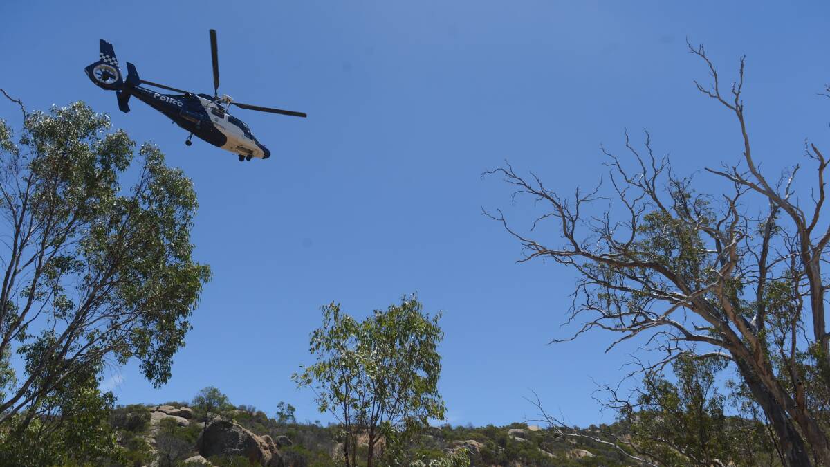 Police helicopter is flying over the mountain to help locate the body. Picture: Jim Aldersey