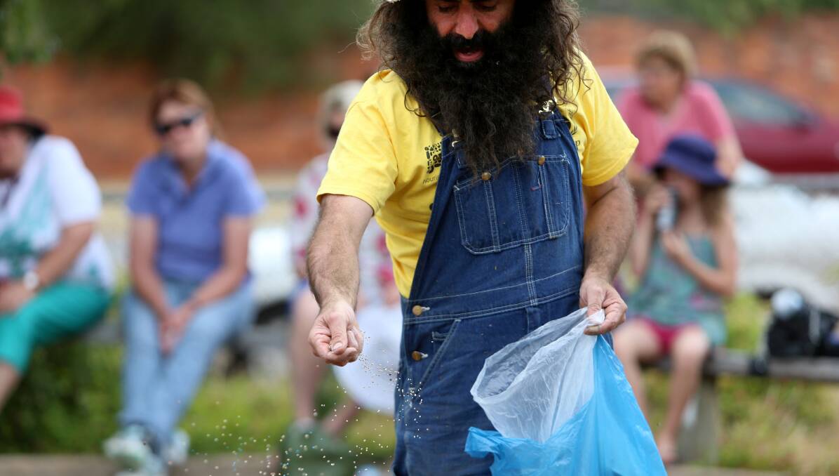 ABC's Gardening Australia  host Costa Georgiadis demonstrates gardening techniques. Picture: LIZ FLEMING