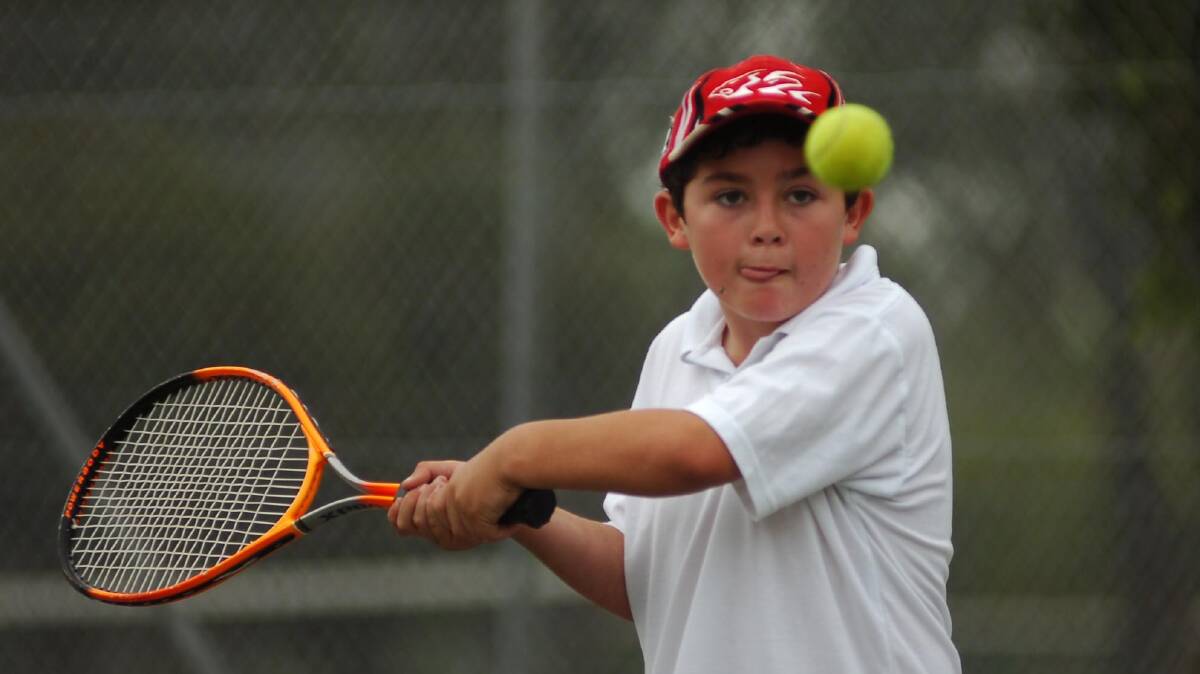 Dean Foster playing for the Holy Rosary Alpha's U12's playing at the Coca Cola Tennis centre 
pic by Bill Conroy 29/10/05