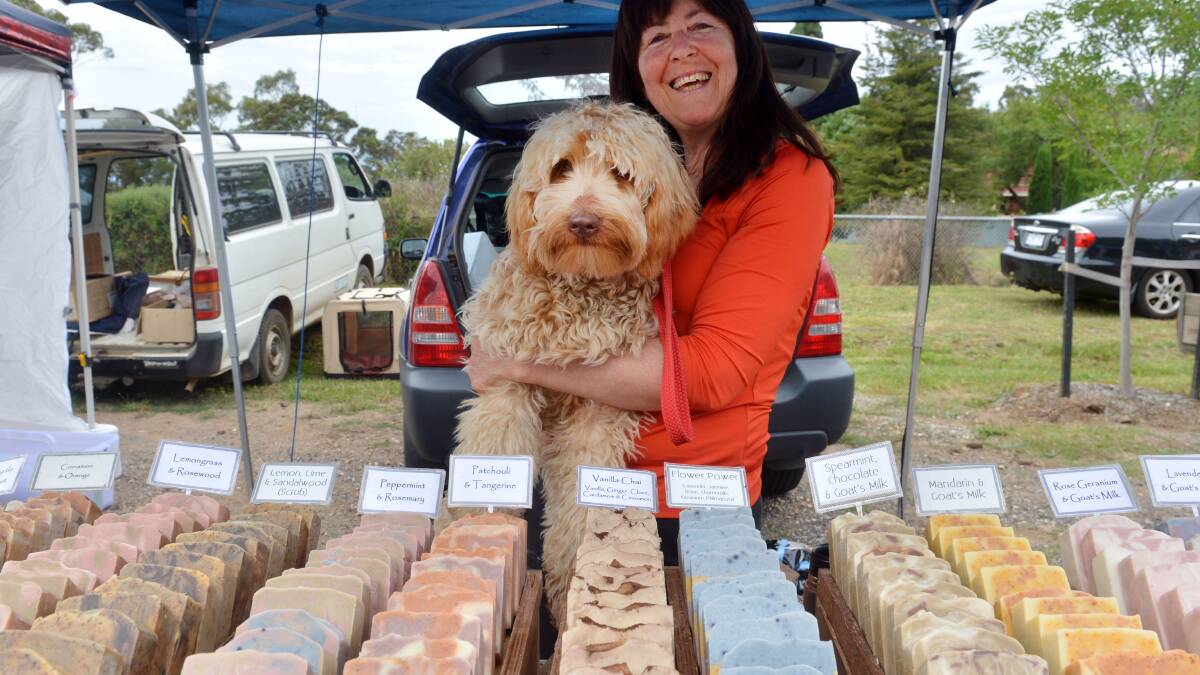 Satchmo, the stallholders dog with Cathy Mulcahy of Native Bliss Skincare. Picture: BRENDAN McCARTHY