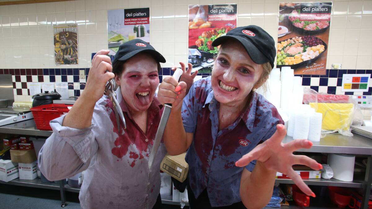 Eaglehawk IGA staff dressed up in halloween costumes.
Danger in the deli department Jessica Rivett and Grace Rawiller.
Picture: PETER WEAVING
311013