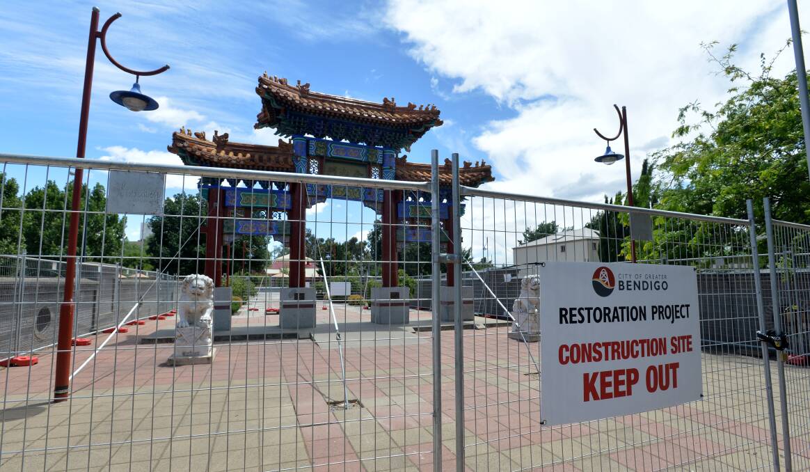 DAMAGED: Termites and rot have caused structural damage to the ornate Chinese archway.