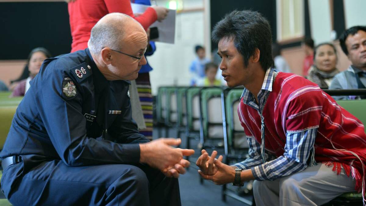Victorian Police Chief Commissioner Ken Lay chats with Kaw Doh at last year's Festival of Cultures in Bendigo. Picture: BRENDAN McCARTHY