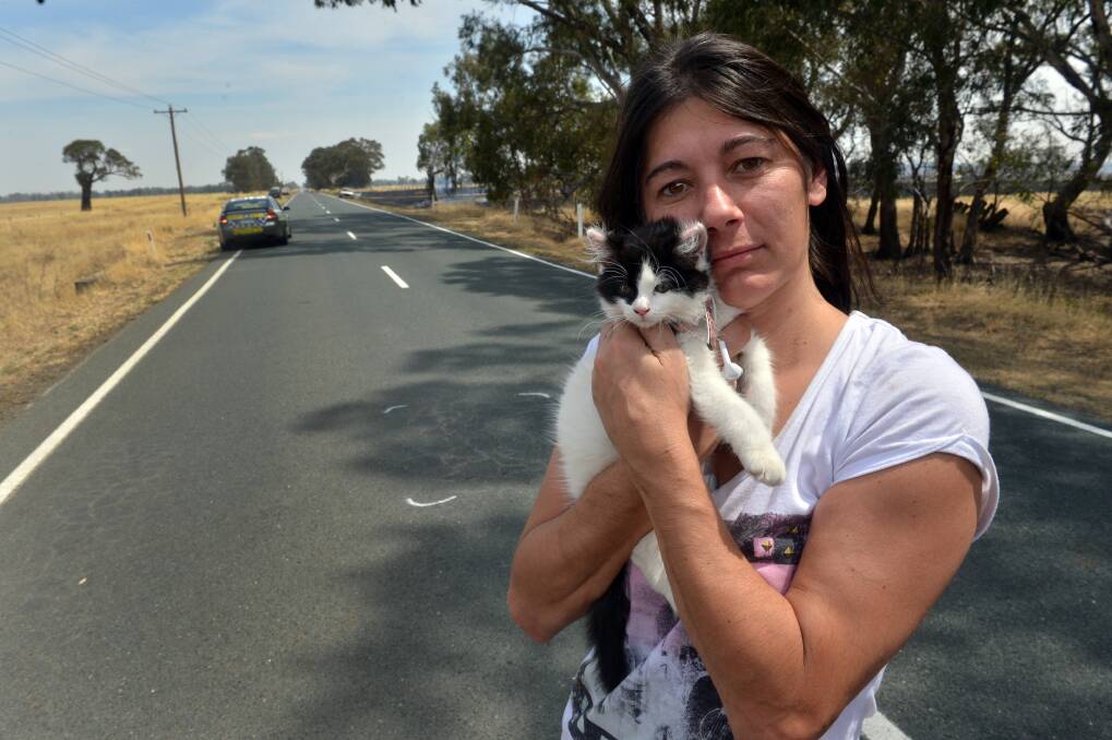 LUCKY ESCAPE: Jodie Spencer, and Kit E Kat who escaped the car. Picture: BRENDAN McCARTHY