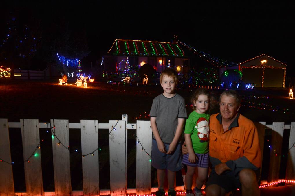 Christmas Lights, Nicholas, 7, and Ava, 4, and Paul Armitage. Picture: JIM ALDERSEY