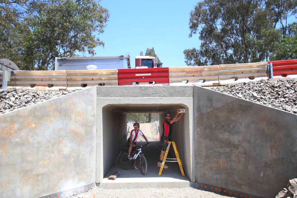NEARLY FINISHED: Garry Long and Matt Pollard in the tunnel at Axedale. Picture. PETER WEAVING