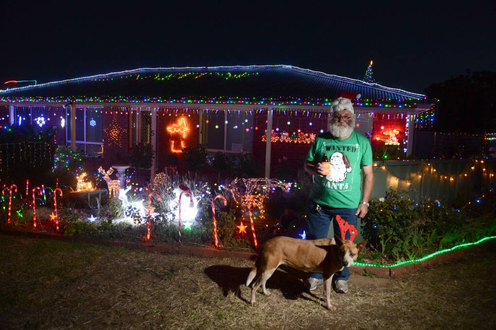 MERRY: Bruce McCallum with Rosie in front of his Excell Street home.
