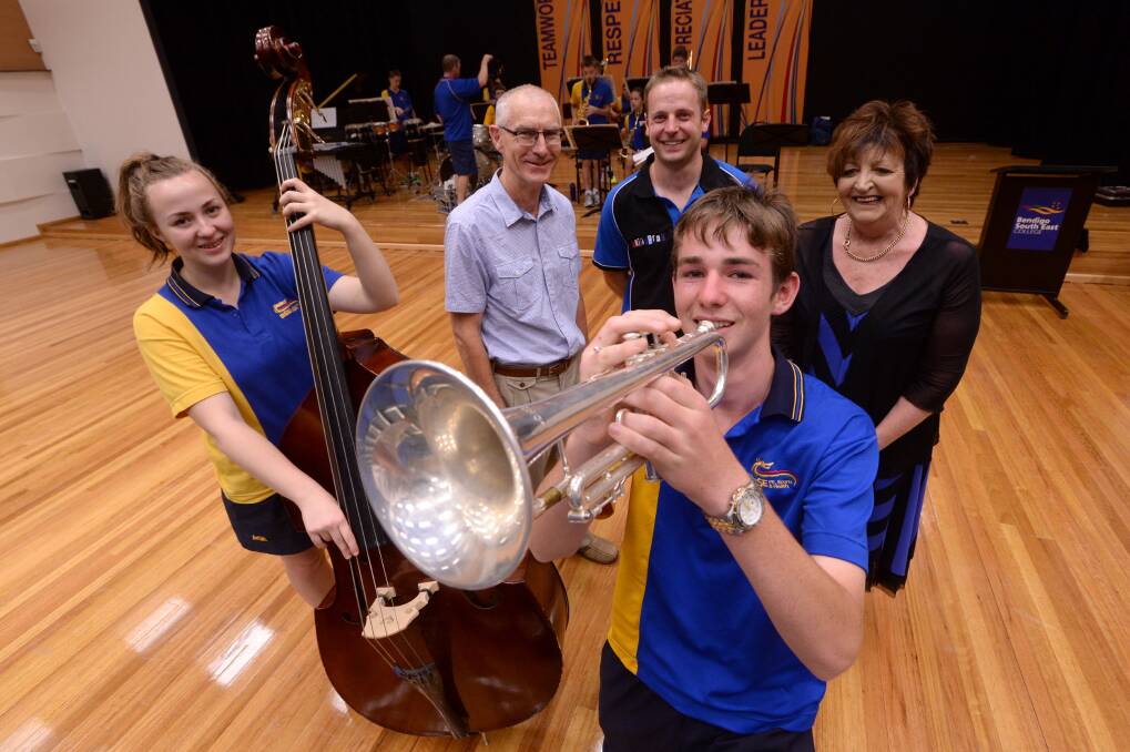 BSE student Thea Morton playing the Double Bass, Bendigo Competitions Society Music Co-ordinator David Castles, BSE Arts area leader Stephen Briggs, Bendigo Competition Society President Fay Thomas and student Colin Humprey playing the Trumpet. Picture: JIM ALDERSEY
