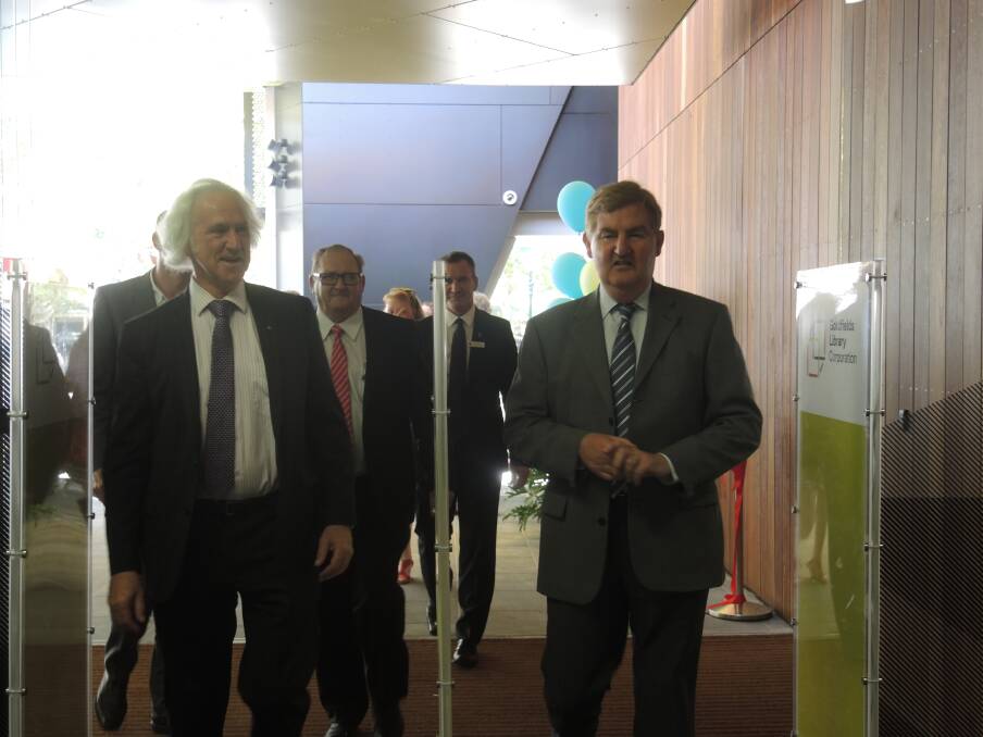 Councillor Rod Fyffe, Mayor Barry Lyons and Deputy Premier Peter Ryan walk into the newly opened library. Picture: WENDY WILLIAMS