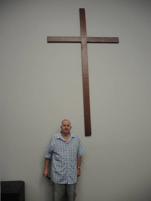 Ian Tyers from the Maryborough Men's Shed which made the cross.