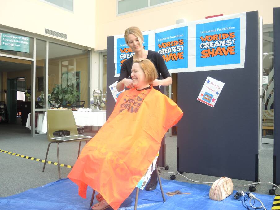 Margaret shaves Naomi Fayers' head