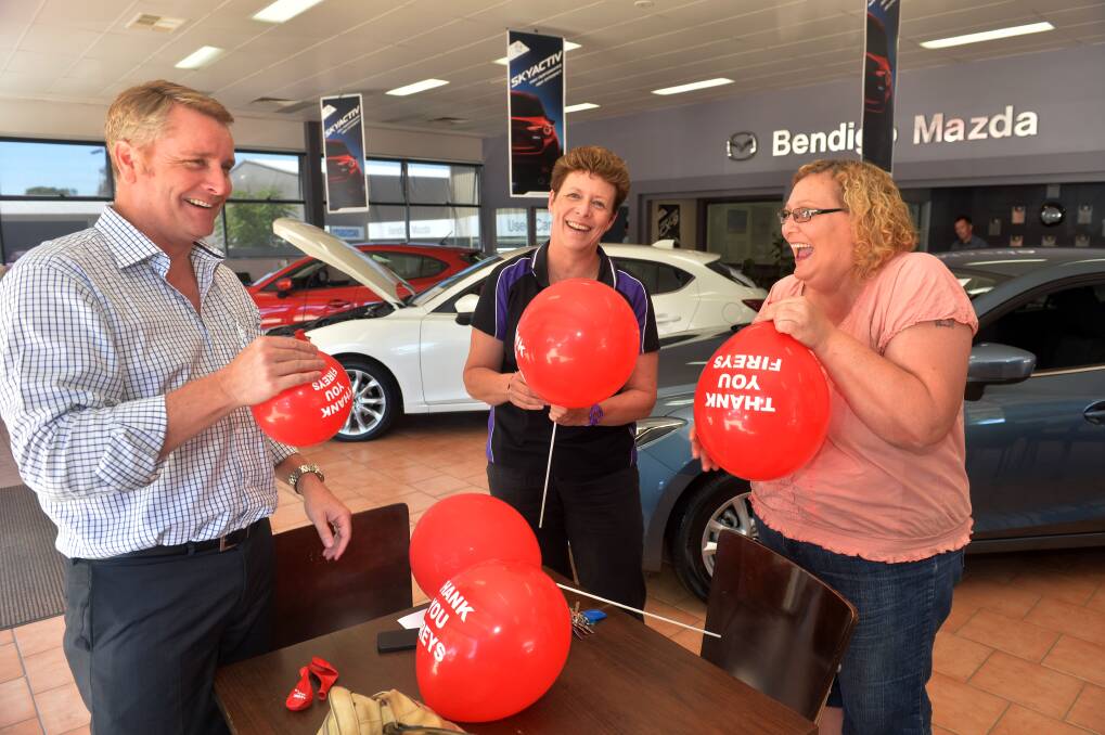 GRATEFUL: Bendigo Mazda dealer principal Richard Opie, Janine Ralph from Ad Infinitem Promotions and National Red Balloon Day co-ordinator Jody Hardiman.