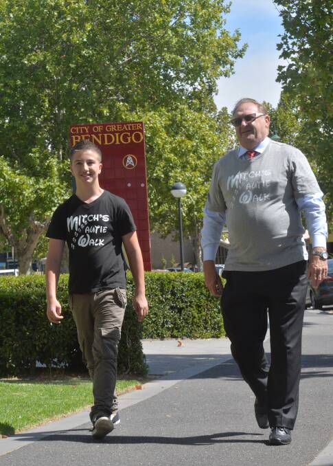 SUPPORT: Mitchell Bourke takes a walk with Mayor Barry Lyons. Picture: PETER WEAVING