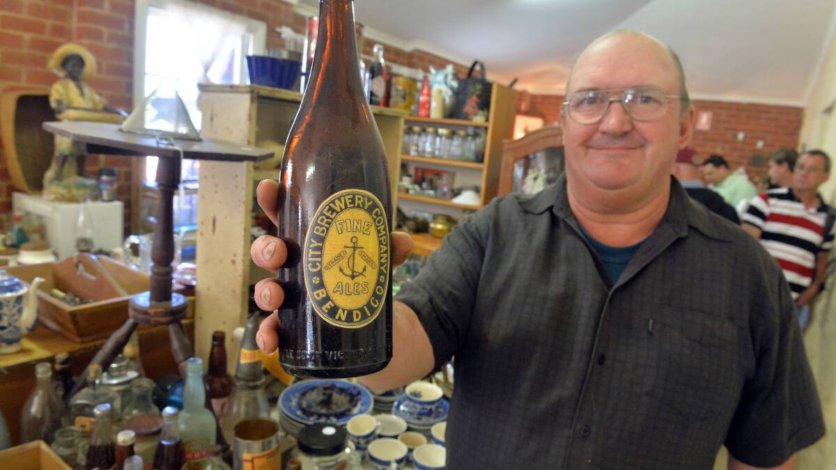 Stallholder Andrew Hough with a Bendigo Ale bottle. Picture: BRENDAN McCARTHY