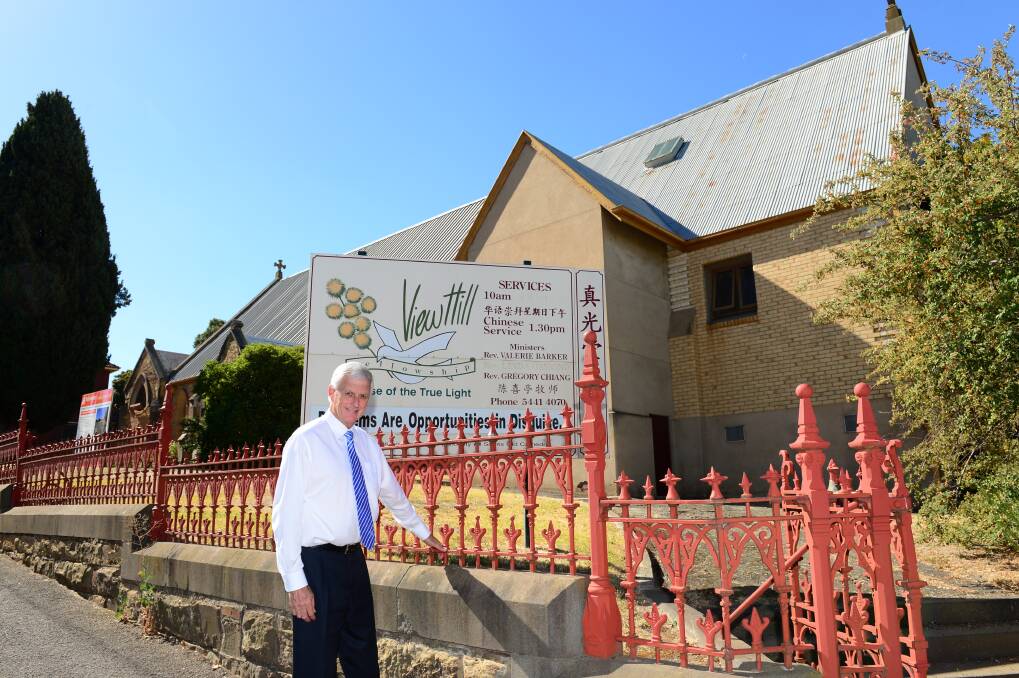 SPECIAL LOT: Real Estate Agent Craig Tweed in front of the All Saints Cathedral. Picture: JIM ALDERSEY