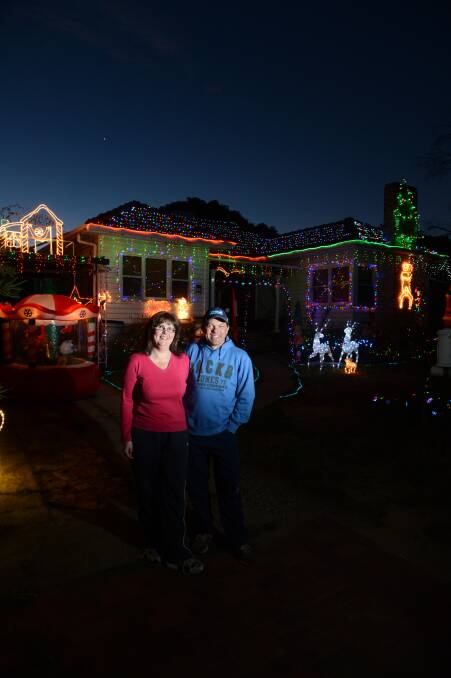 Andrea and Brett Whittle from Britain st in front of their house.
Picture: JIM ALDERSEY